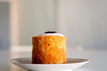 Runeberg's tart or cake is a Finnish traditional dessert and pastry that is originally made of gingerbread and bread crumbs, almonds, while rasberry jam and sugar on top