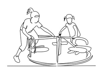 children spinning on the carousel