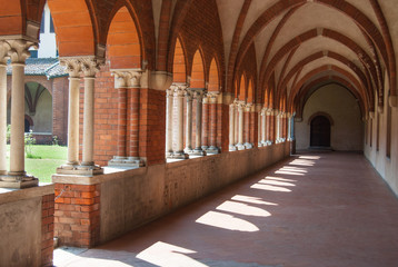Fototapeta na wymiar Part of courtyard with colonnade inside the Chiaravalle monastery