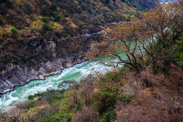 From the heights, overlook the majestic Jinsha River and the mountains on both sides, in Lijiang, Yunnan, China.