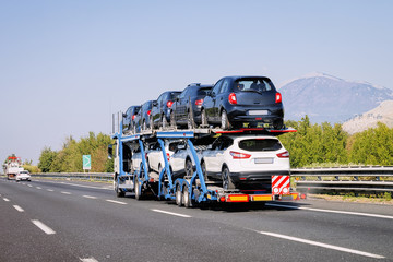 Cars carrier in road