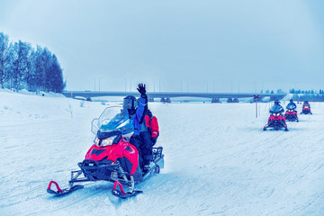 People in Snow mobiles Winter Finland Lapland during Christmas