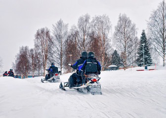 People on Snow mobiles Winter Finland Lapland during Christmas