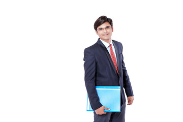 Young Indian businessman holding document file over white background