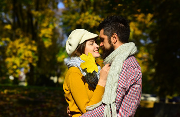 Fototapeta premium Man and woman with happy faces on autumn trees background