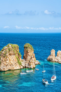 Ships in Mediterranean sea in Scopello Sicily Italy