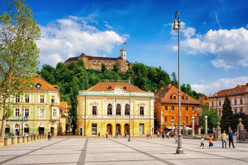 Academia Philarmonic on Congress square and Old castle Ljubljana Slovenia - obrazy, fototapety, plakaty