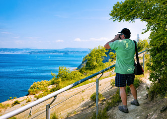 Man taking photos of nature and Adriatic sea Strunjan Slovenia