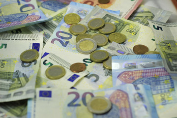 Close up of a pile of money (Euro, cash and coins). Concept: A lot of money, rich, Wealth, success