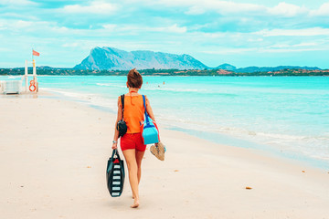 Woman at La Cinta beach San Teodoro in Sardinia Italy