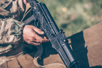 The instructor shows how to disassemble the AK-47 Kalashnikov