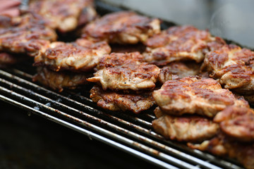 An opulent barbecue with pork cutlets.