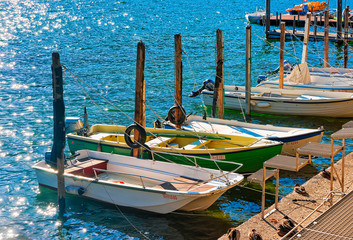 Fototapeta na wymiar Boats at waterfront in expensive resort Ascona Ticino Switzerland CH