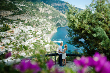 Young smiling tender romantic couple in Positano, Italy