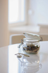 Dried bay leaves in a glass jar: These are used to reduce anxiety and stress by smudging at home. Bay leaves have been used as a medical herb and an herbal treatment and remedy for centuries