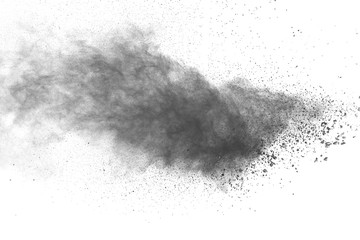 Black powder explosion against white background. - obrazy, fototapety, plakaty