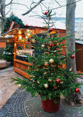 Fototapeta na wymiar Christmas Tree near Market at Kaiser Wilhelm Memorial Church Berlin