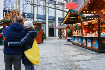 Senior Couple at Christmas Market at Kaiser Wilhelm Memorial Berlin