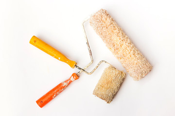 Used and dirty roller paint brush isolated on white background