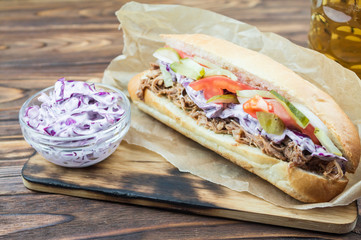 sandwich with pulled pork and cole slaw, close-up