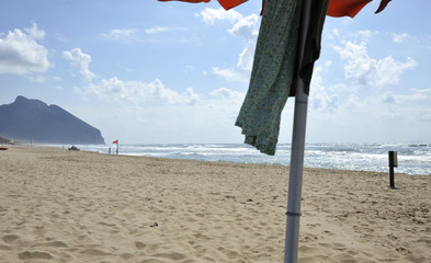 Under the umbrella on the beautiful Sabaudia beach. Sabaudia, Lazio, Italy