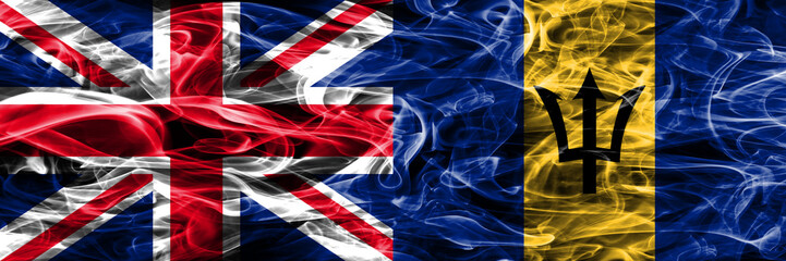 United Kingdom vs Barbados smoke flags placed side by side. Thick colored silky smoke flags of Great Britain and Barbados