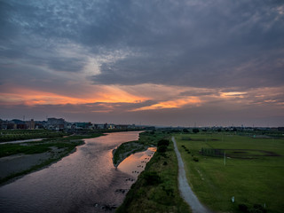 It is the view of the evening. The river flows between the Tama river and nice Japan's Tokyo and Kanagawa prefectures. Orange is very beautiful.