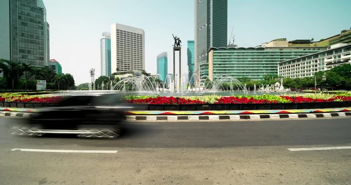 JAKARTA, Indonesia - August 24, 2018: Time lapse footage of Hotel Indonesia roundabout with Selamat Datang Monument in Central Jakarta, Indonesia. Shot in 4k resolution