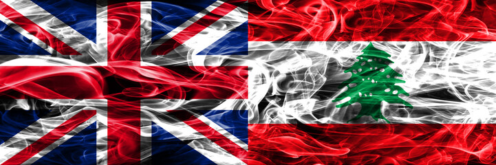 United Kingdom vs Lebanon smoke flags placed side by side. Thick colored silky smoke flags of Great Britain and Lebanon