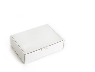 Naklejka premium Cardboard paper box on a white background