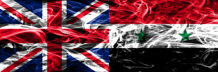 United Kingdom vs Syria smoke flags placed side by side. Thick colored silky smoke flags of Great Britain and Syria