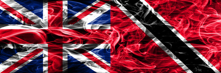 United Kingdom vs Trinidad and Tobago smoke flags placed side by side. Thick colored silky smoke flags of Great Britain and Trinidad and Tobago