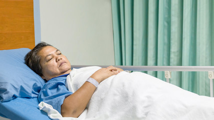 Doctor visits old female patient at her patient room