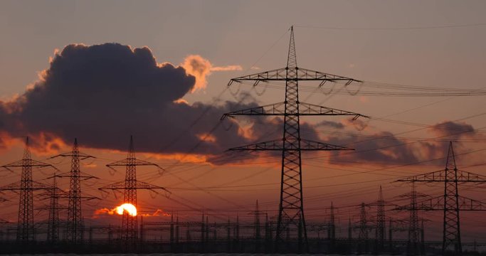 Power poles in a german landscape and a nice sunset