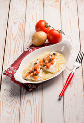 sea bass with fresh tomatoes over mashed potatoes