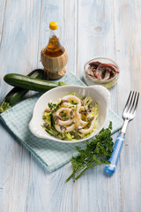 rings squid with zucchinis and anchovies
