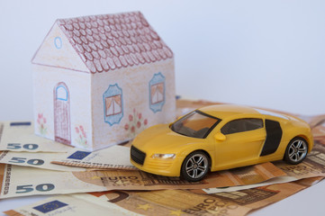 money toy car and house, top and side view