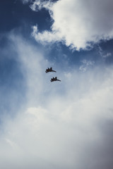 Naklejka na ściany i meble Military aircraft in the sky over St. Petersburg