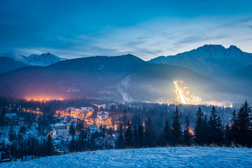 Winter skiing competitions at dusk in winter in Zakopane, Poland