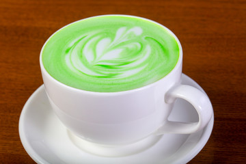Green cappuccino with cream
