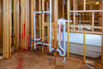 New under construction bathroom interior with interior framing of new house under construction
