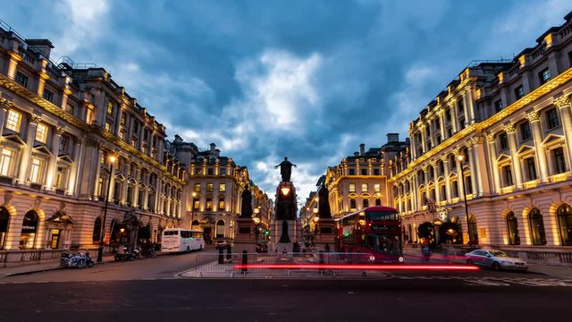 Time lapse view of traffic and floodlit regency building in Pall Mall in London at sunset