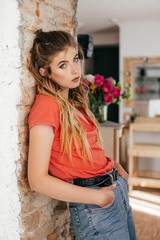 Portrait of beautiful woman with makeup in fashion red clothes 