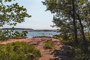 Helsinki Finland, sunny summer day at the shore looking from the woods