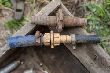 Connecting garden hose for watering. Old garden accessories.