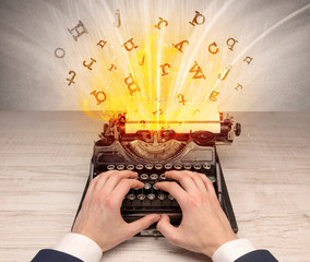 First person perspective image with exploding letters from a vintage typewriter concept

