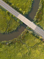 Local road crosses over the many twists and bends of the Maurice River and tributaries as seen from...