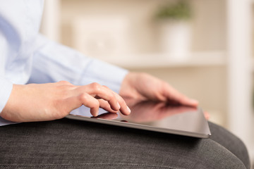Fototapeta premium Business woman below chest using tablet in a homey environment 