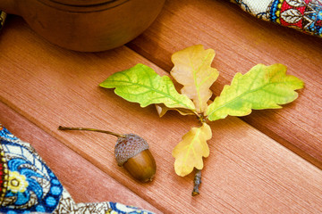 oak leaves on wooden background