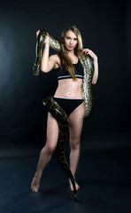 perfect girl and giant python in the studio
